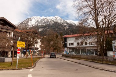 OBERSTDORF, GERMANY - FEBRUARY 24, 2024: On the streets of Oberstdorf in the end of February clipart