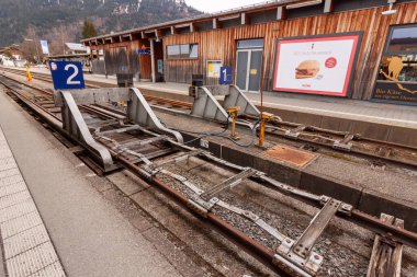 OBERSTDORF, GERMANY - FEBRUARY 24, 2024: On the Oberstdorf railway station in the end of February clipart