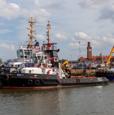 CUXHAVEN, GERMANY - AUGUST 15, 2024: Harbor tugs WULF 7 and WULF 9. The tugs are used as harbor tugs for Cuxhaven as well as for general towing operations in the North and Baltic Seas clipart