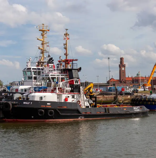 stock image CUXHAVEN, GERMANY - AUGUST 15, 2024: Harbor tugs WULF 7 and WULF 9. The tugs are used as harbor tugs for Cuxhaven as well as for general towing operations in the North and Baltic Seas