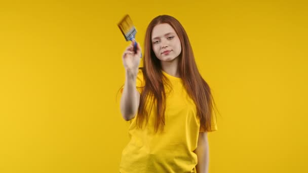 Ginger Woman Artist Imitates Painting Brush Yellow Background Creative Person — Stock Video