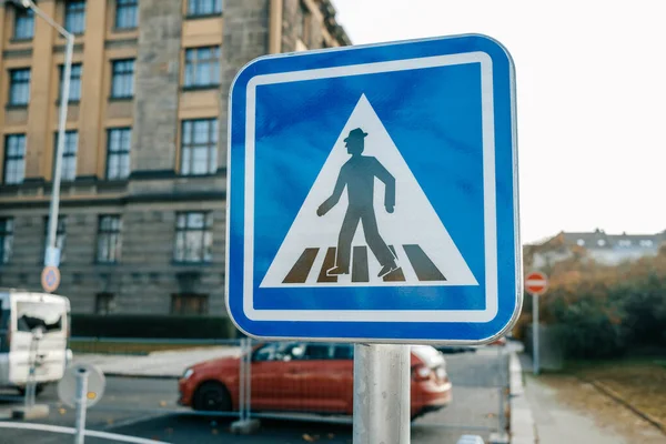 Blue road pedestrian crossing sign, crosswalk, old zebra warning signal. High quality photo
