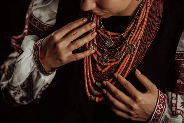 stock image Demonstrating traditional antique jewelry necklace. National costume of Ukraine. Ukrainian woman in legacy ancient coral beads, Zgarda - archaic hutsul neck ornament of status religious purpose.