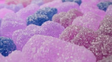 Jöle jelibon ayıcıkları dokusu arka planının aşırı makro kaygan görüntüsü. Renkli marmelat şekerlemeleri. Yüksek kalite 4k görüntü