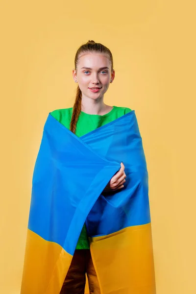 stock image Happy woman with national Ukrainian flag on yellow. Ukraine, patriot, victory in war celebration, banner, Independence day. High quality