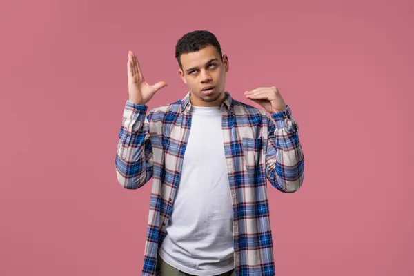 stock image Irritated african american guy showing bla-bla-bla gesture with hands, rolling eyes on pink background. Empty promises, blah concept. Lier. High quality