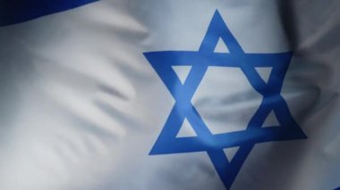 Yahudi bayrağında gerçek bir dalgalanma. Davut 'un yıldızı, Bağımsızlık Günü. Vatanseverlik. Demokrasinin, bağımsızlığın ve geleceğin sembolü. Yüksek kalite 4k görüntü