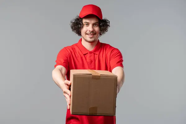 stock image Post courier man delivering parcel box to recipient. Got payment for service. Postal worker, home delivery. High quality