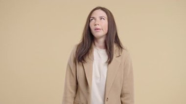 Bored Upset Businesswoman Sighs, Rolling Eyes On beige. Offended Lady, Come On. Pretty model in displeasure, she is tired of situation, empty promises, talks. High quality 4k footage