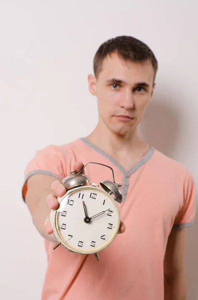 Portrait Young Man Pink Shirt Holding Vintage Alarm Clock Light — Stock Photo, Image