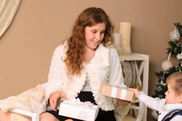 Little Son Holds Out Gift His Mother Who Dressed White — Stock Photo, Image