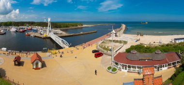 2022-06-02 panoramic view of quay, harbor and swing bridge at mouth of Slupia. popular resort at baltic sea. Ustka, Poland 