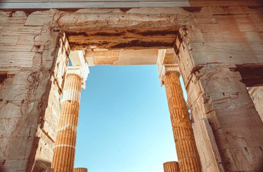 Closeup View on a Beautiful Arch of Parthenon over Bright Sunny Sky Background. Amazing Ruins of Athens. Old Vintage Architecture. Temple. Greece. Europe.