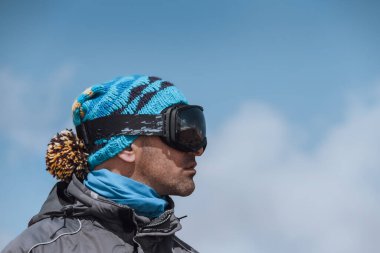 Profile Portrait of a Man Enjoying Landscape. Winter Sport in the Mountains. Wintertime Vacation. Active People Lifestyle.