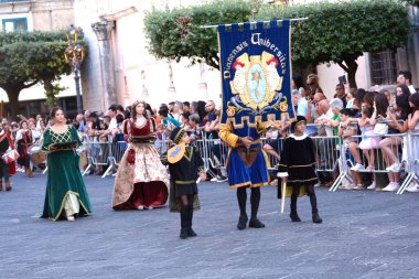 Teggiano, Italy - August 11, 2024, Medieval Festival : Everybody at the table with princess Costanza. clipart