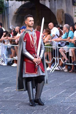 Teggiano, Italy - August 11, 2024, Medieval Festival : Everybody at the table with princess Costanza. clipart