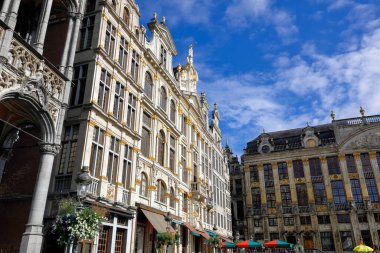 Brussels, Belgium - September 16, 2022: Houses on Grand Place on a sunny day. Le Marchand d'Or , Le Pigeon , La Chaloupe d'Or , L'Ange , Joseph et Anne , Le Cerf , and House of the Dukes of Brabant