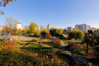 Warsaw, Poland - November 6, 2022: Multi-storey apartment buildings are adjacent to extensive park areas here in the Goclaw estate, in the Praga Poludnie district