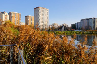 Warsaw, Poland - November 6, 2022: Multi-storey apartment buildings are adjacent to extensive park areas here in the Goclaw estate, in the Praga Poludnie district
