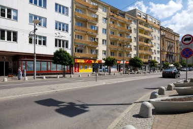 Gdynia, Poland - June 3, 2022: Buildings and streets in the city center. There are multi-story, multi-family residential buildings located along the main street leading through the city.