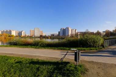 Warsaw, Poland - November 6, 2022: Multi-storey apartment buildings are adjacent to extensive park areas here in the Goclaw estate, in the Praga Poludnie district