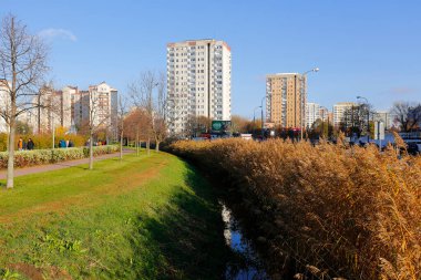 Warsaw, Poland - November 6, 2022: Multi-storey apartment buildings are adjacent to extensive park areas here in the Goclaw estate, in the Praga Poludnie district