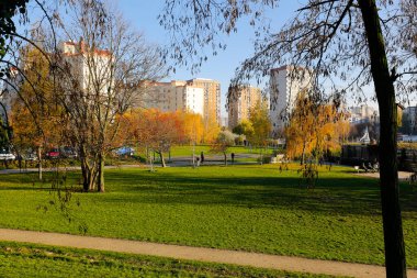 Warsaw, Poland - November 6, 2022: Multi-storey apartment buildings are adjacent to extensive park areas here in the Goclaw estate, in the Praga Poludnie district