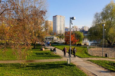 Warsaw, Poland - November 6, 2022: Multi-storey apartment buildings are adjacent to extensive park areas here in the Goclaw estate, in the Praga Poludnie district