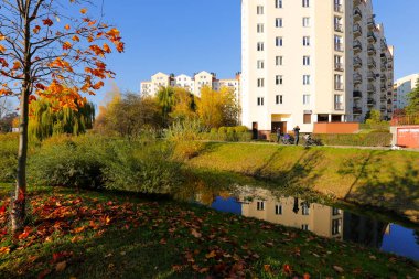 Warsaw, Poland - November 6, 2022: Multi-storey apartment buildings are adjacent to extensive park areas here in the Goclaw estate, in the Praga Poludnie district.