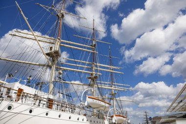 Gdynia, Poland - May 27, 2022: The masts of the tall-ship Dar Pomorza as seen against the sky. This training ship now serves as a museum and is moored at the quayside.