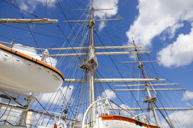 Gdynia, Poland - May 27, 2022: The masts of the tall-ship Dar Pomorza as seen against the sky. This training ship now serves as a museum and is moored at the quayside.
