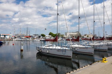 Gdynia, Poland - June 3, 2022: Various boats, motorboats and sailboats are moored in the marina located at the southern pier of the port of Gdynia on the Baltic Sea in the Bay of Gdansk