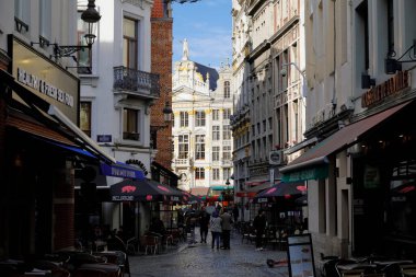 Brussels, Belgium - September 16, 2022: The historic house named La Chaloupe d'Or on the Grand Place is seen between the houses of a narrow street. This building is illuminated by sunlight