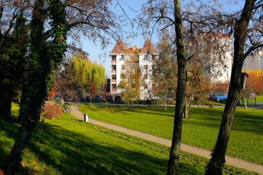 Warsaw, Poland - November 6, 2022: Multi-storey apartment buildings are adjacent to extensive park areas here in the Goclaw estate, in the Praga Poludnie district.