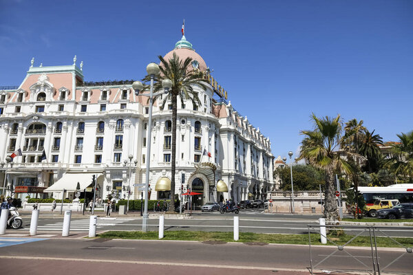 Nice, France - April 26, 2023: The imposing building that houses the legendary Hotel Negresco is visible across the Promenade des Anglais