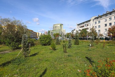 Warsaw, Poland - September 24, 2023: In the Goclaw housing estate in the Praga-Poludnie district, nature coexists with the homes of many families. clipart