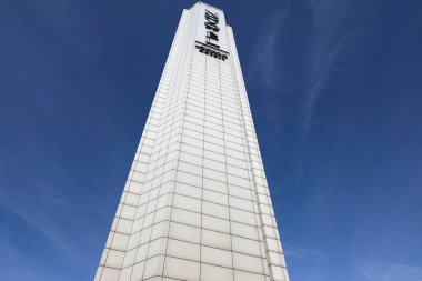 Warsaw, Poland - September 20, 2023: A tall flat building that houses a hotel that is part of the world famous hotel network. Here you can see the famous landmark of the city against the blue sky. clipart