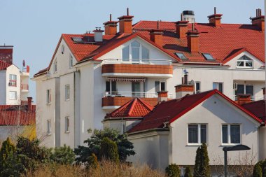 Warsaw, Poland - March 8, 2024: Multi-dwelling buildings in the Goclaw subdivision of the Praga-Poludnie district clipart