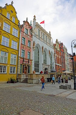 Gdansk, Poland - October 10, 2024: Facades of old houses, including the Artus Court in the historic, most popular, most visited part of the city. clipart