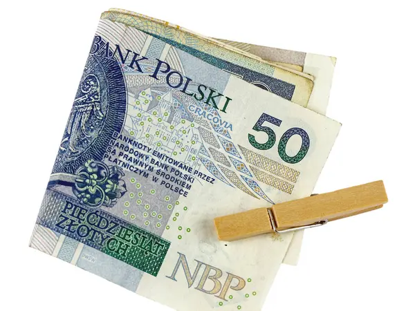 Birkaç Polonya Zloti banknotu ikiye katlandı ve bir çamaşır klipsiyle tutturuldu. Bu tema çok çeşitli finansal sorunları temsil edebilir.