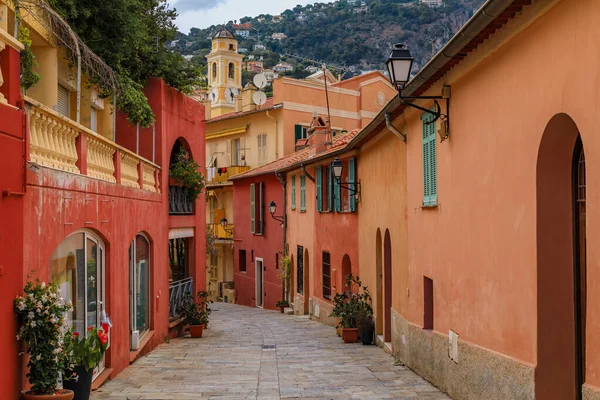 stock image Traditional old terracotta houses on a narrow street in the Old Town of Villefranche sur Mer on the French Riviera, South of France