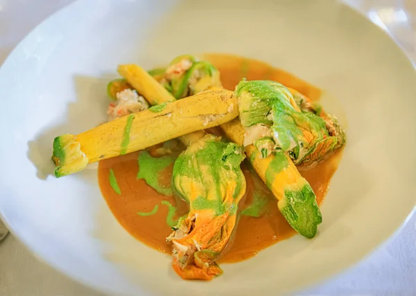 Traditional delicacy from South of France stuffed courgette or zucchini flowers at a restaurant in old town Villefranche sur Mer, South of France