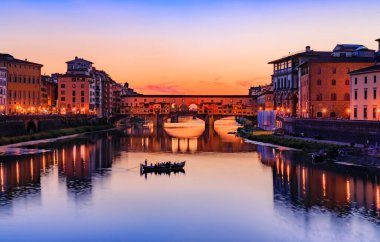 Sunset cityscape with the famous bridge of Ponte Vecchio on the river Arno River in Centro Storico, Florence, Italy