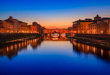 Sunset cityscape with the famous bridge of Ponte Vecchio on the river Arno River in Centro Storico, Florence, Italy