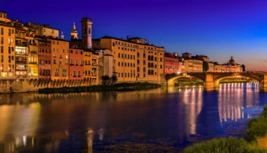 Sunset cityscape with the St Trinity Bridge or Ponte Santa Trinita on the river Arno River in Centro Storico, Florence, Italy at sunset blue hour