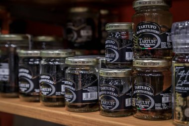 Florence, Italy - June 03, 2022: Exotic whole white summer truffle from Giuliano Tartufi brand on display at a shop in Central Market Mercato Centrale