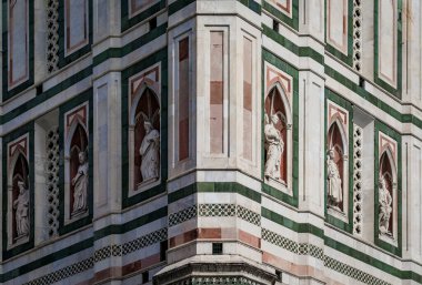 Ornate carved marble figure of angel saints at the Duomo Cathedral or Cattedrale di Santa Maria del Fiore in Florence, Italy