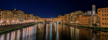 Sunset cityscape with the famous bridge of Ponte Vecchio on the river Arno River in Centro Storico, Florence, Italy