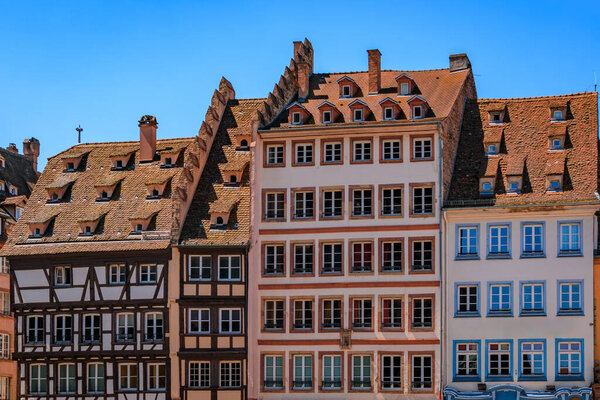 Ornate traditional half timbered houses with steep roofs in the old town of Grande Ile, the historic center of Strasbourg, Alsace, France
