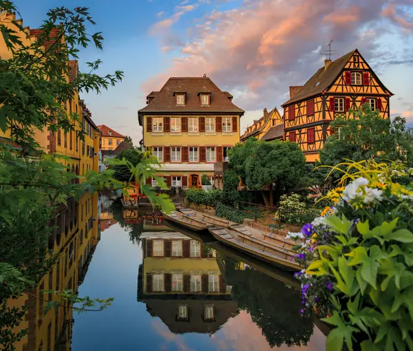 stock image Ornate traditional half timbered houses with blooming flowers along the canals, Little Venice district in Colmar, picturesque village in Alsace France